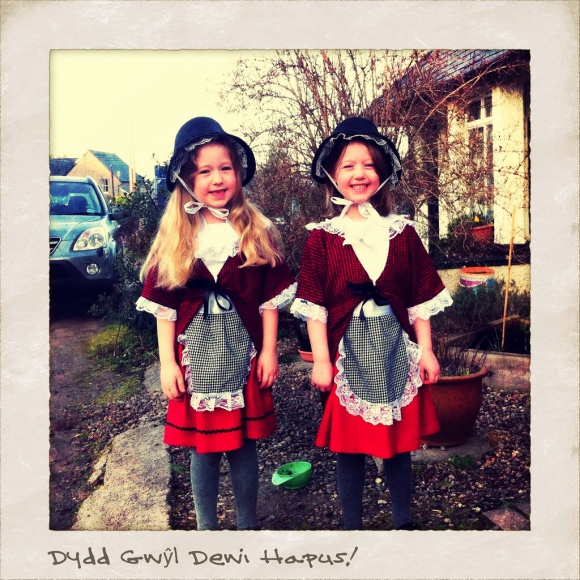 Two young girls dressed in traditional welsh costume